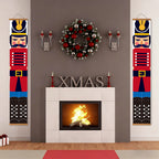 Decorative Christmas scene with nutcrackers, wreath, and fireplace.