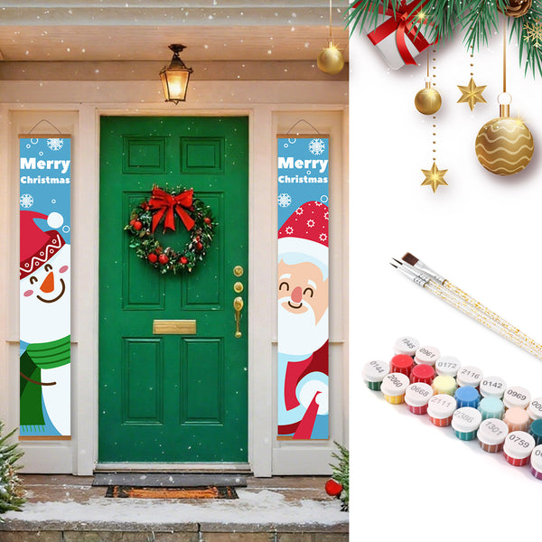 Decorative Christmas banners on a door with festive decorations and paint supplies.