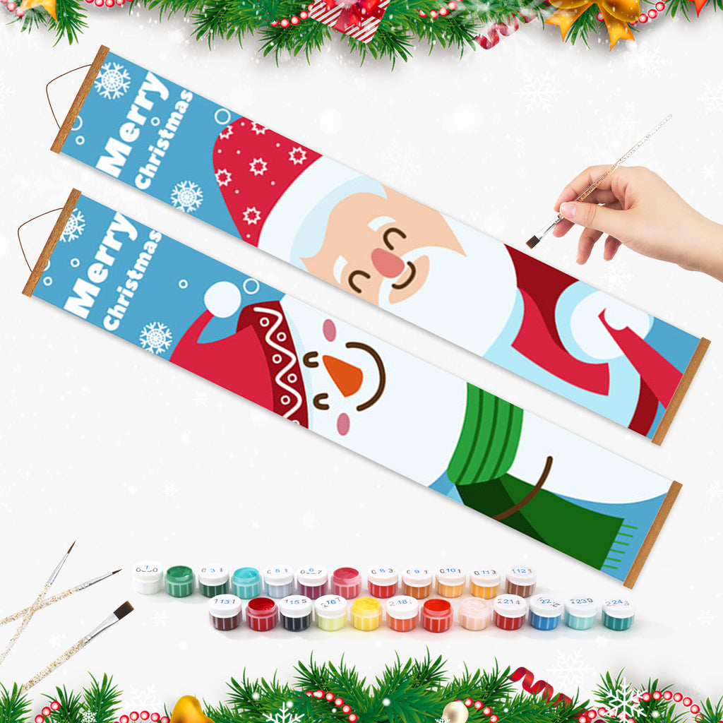 Weihnachtsmalset mit Weihnachtsmann-Motiv und Farbzubehör auf weißem Hintergrund.
