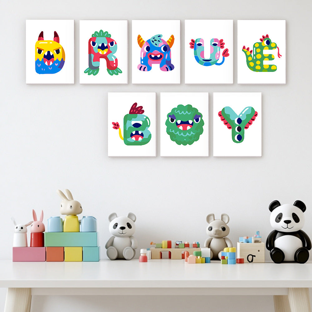 Colorful monster-themed wall art above a children's play area with toys.