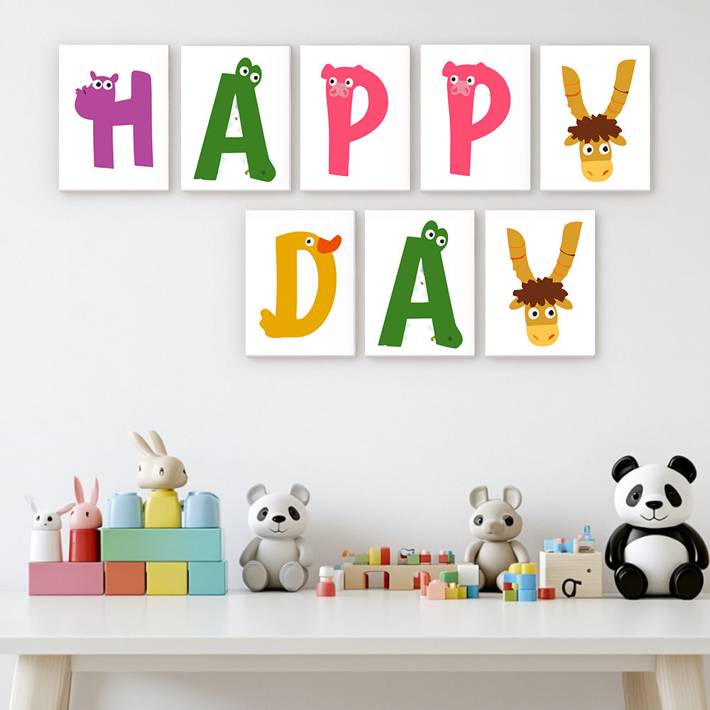 Colorful children's wall art with animal-themed letters on a white wall above a table with toys.