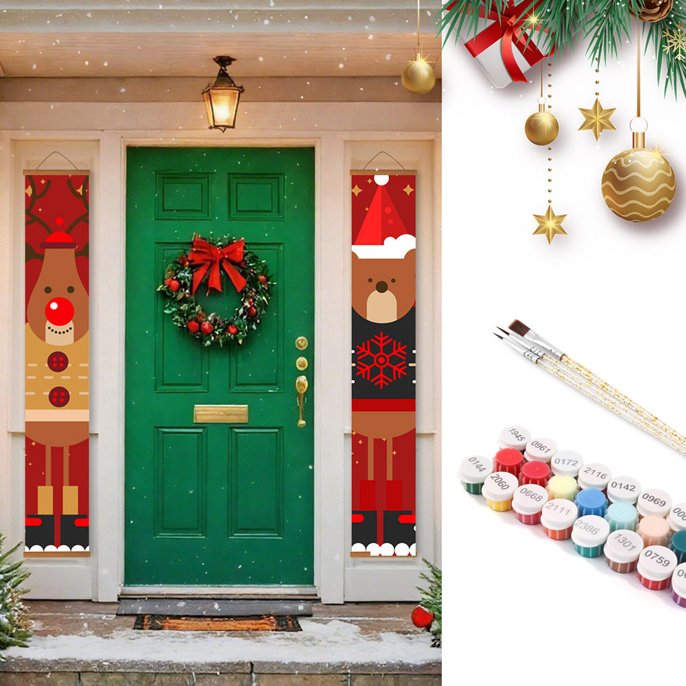 Decorative Christmas door with banners and wreath, paintbrushes, and paint containers.