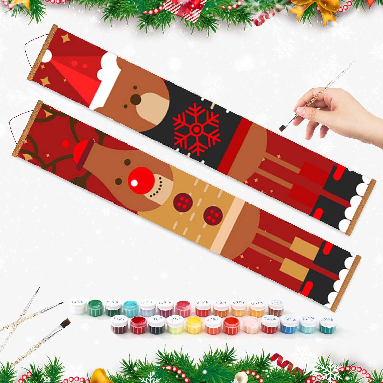 Ensemble de peinture par numéros sur le thème de Noël avec une main tenant un pinceau et une gamme de couleurs de peinture.