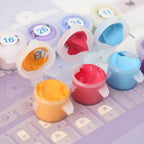 Colorful calendar with numbered compartments and small containers on a light purple background