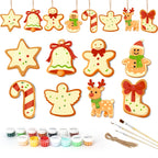 Set of Christmas-themed ceramic decorations with paint supplies on a white background