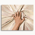 Grip of Desire: a hand gripping cream-colored bedsheets, drawing the fabric into deep folds.