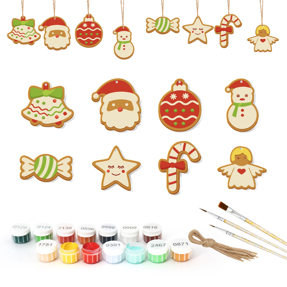 Set of Christmas-themed cookie decorations with paint bottles and brushes on a white background