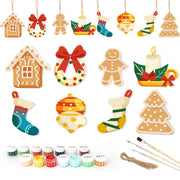Set of Christmas-themed wooden ornaments with paint supplies on a white background