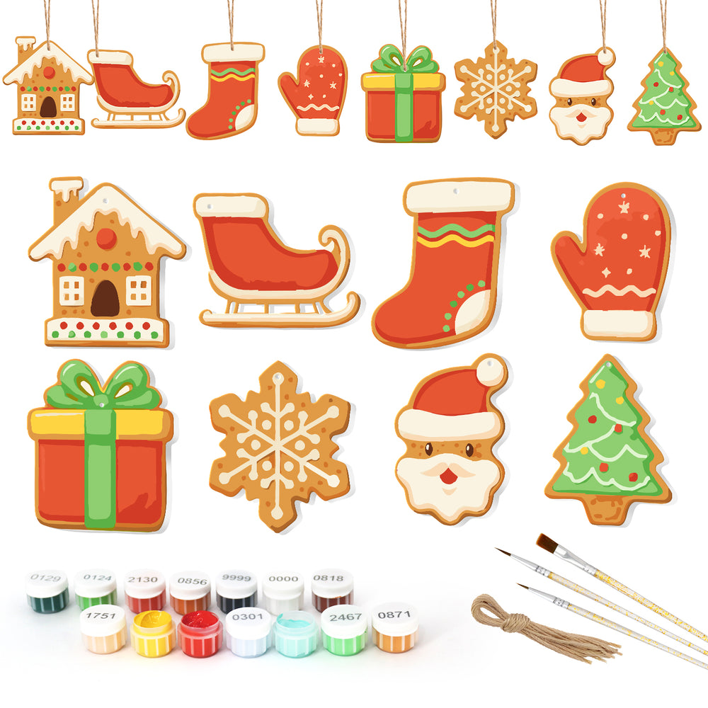 Set of Christmas-themed cookie cutters with paint supplies on a white background