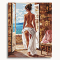 Bare Temptation: a woman seen from behind with white fabric around her hips at an open seaside doorway.