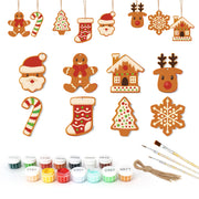 Set of Christmas-themed wooden ornaments with paint bottles and brushes on a white background