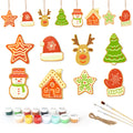 Set of Christmas-themed ceramic decorations with paint cans and brushes on a white background