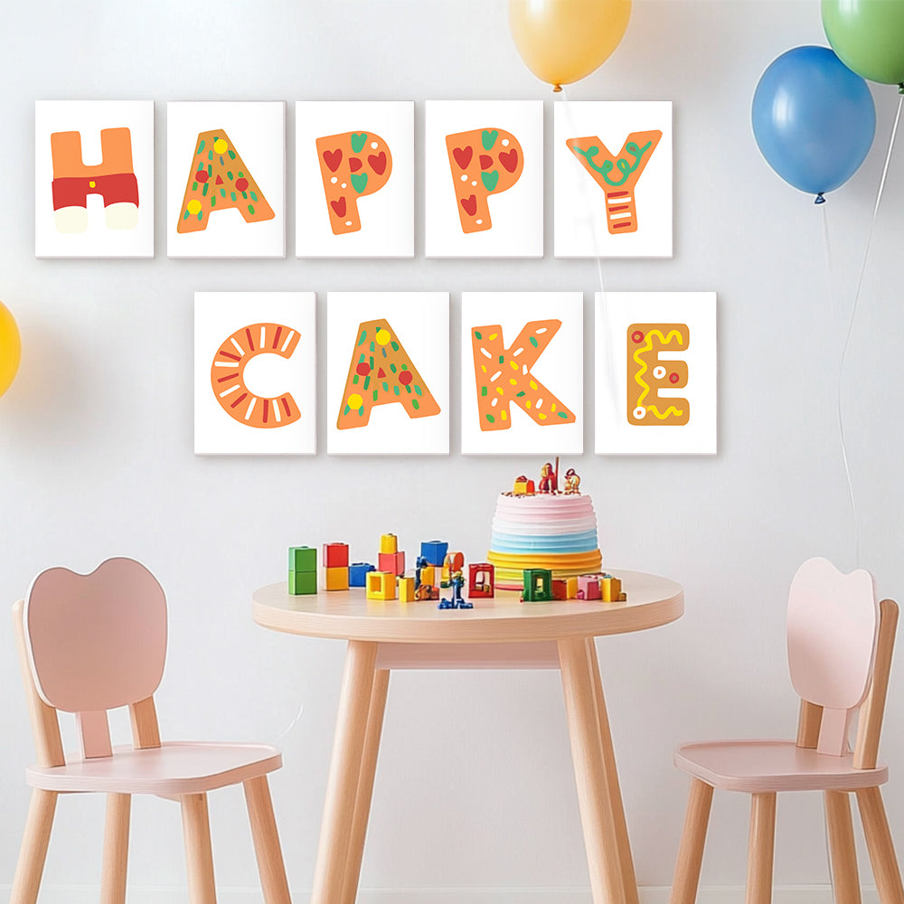 Children's room with colorful 'Happy Cake' wall art, a small cake, and toys on a table.