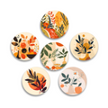 A set of six round coasters with various botanical illustrations and autumn hues.