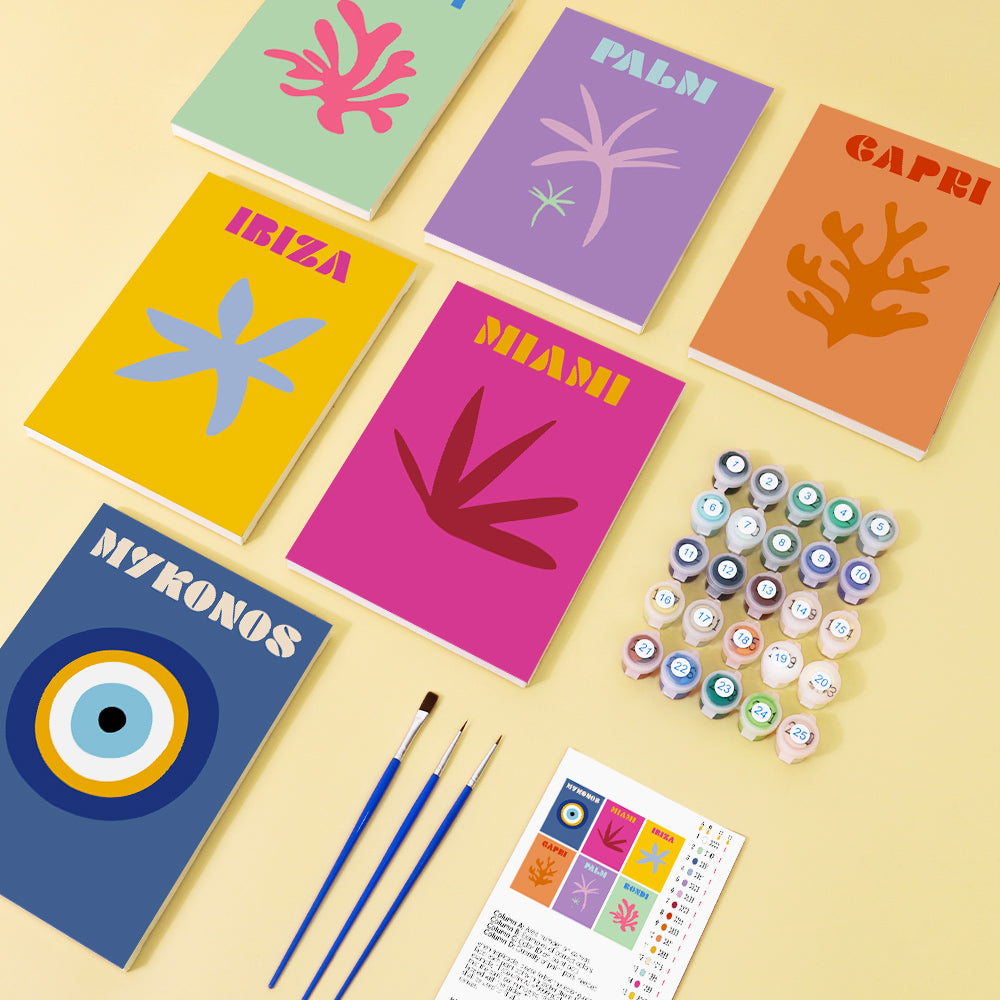 Assorted paint pots from a Mini Escapes paint by numbers kit