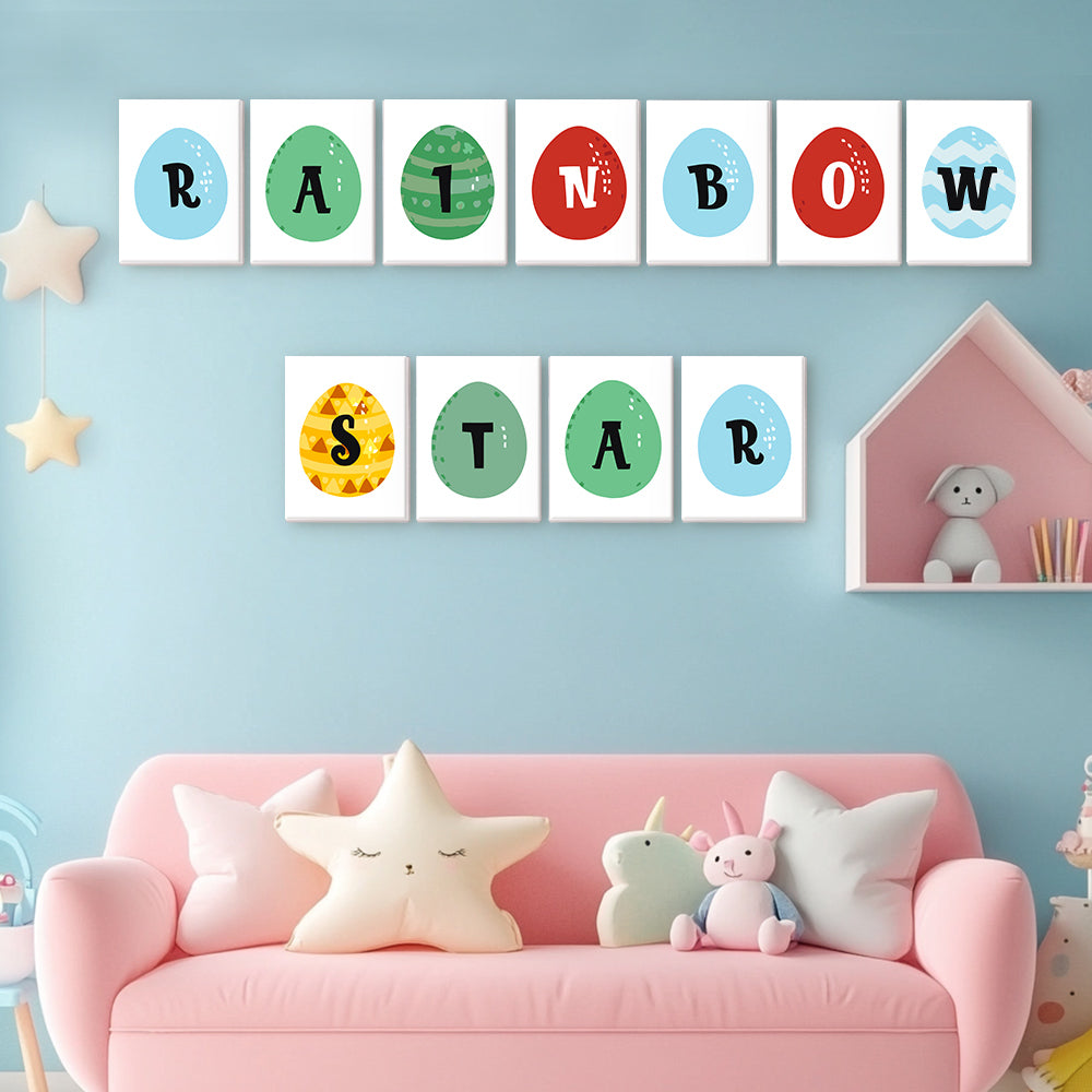 Children's room with a pink sofa, colorful letters on the wall, and toys.