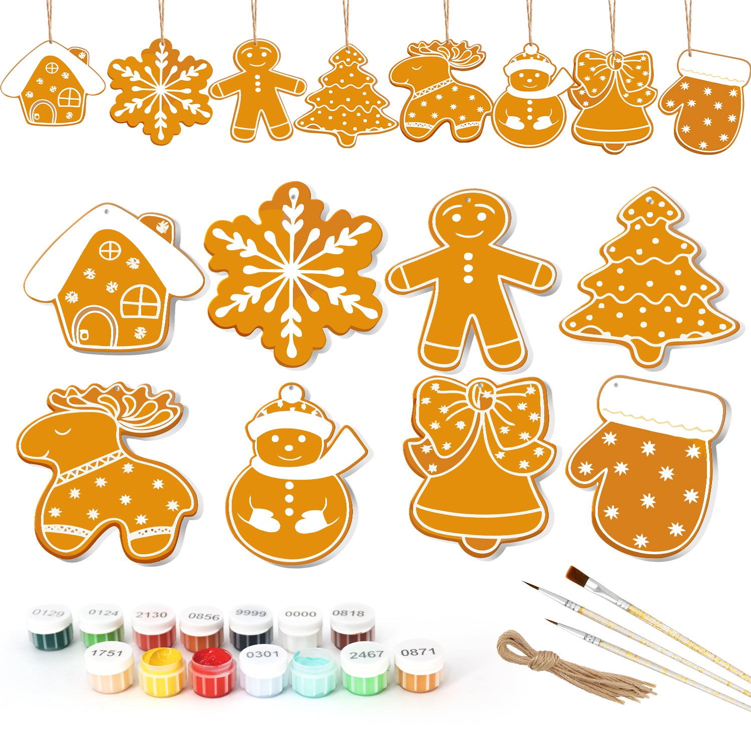 Ensemble d'emporte-pièces sur le thème de Noël avec pots de peinture et pinceaux sur fond blanc