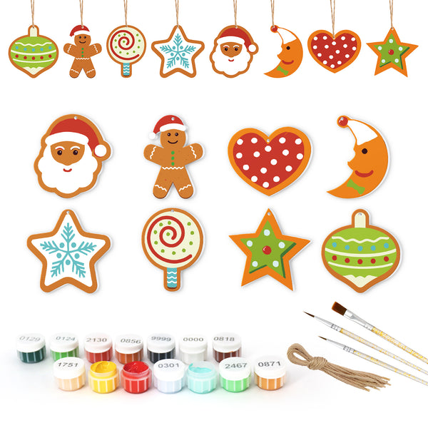 Set of Christmas-themed ceramic decorations with paint bottles and brushes on a white background