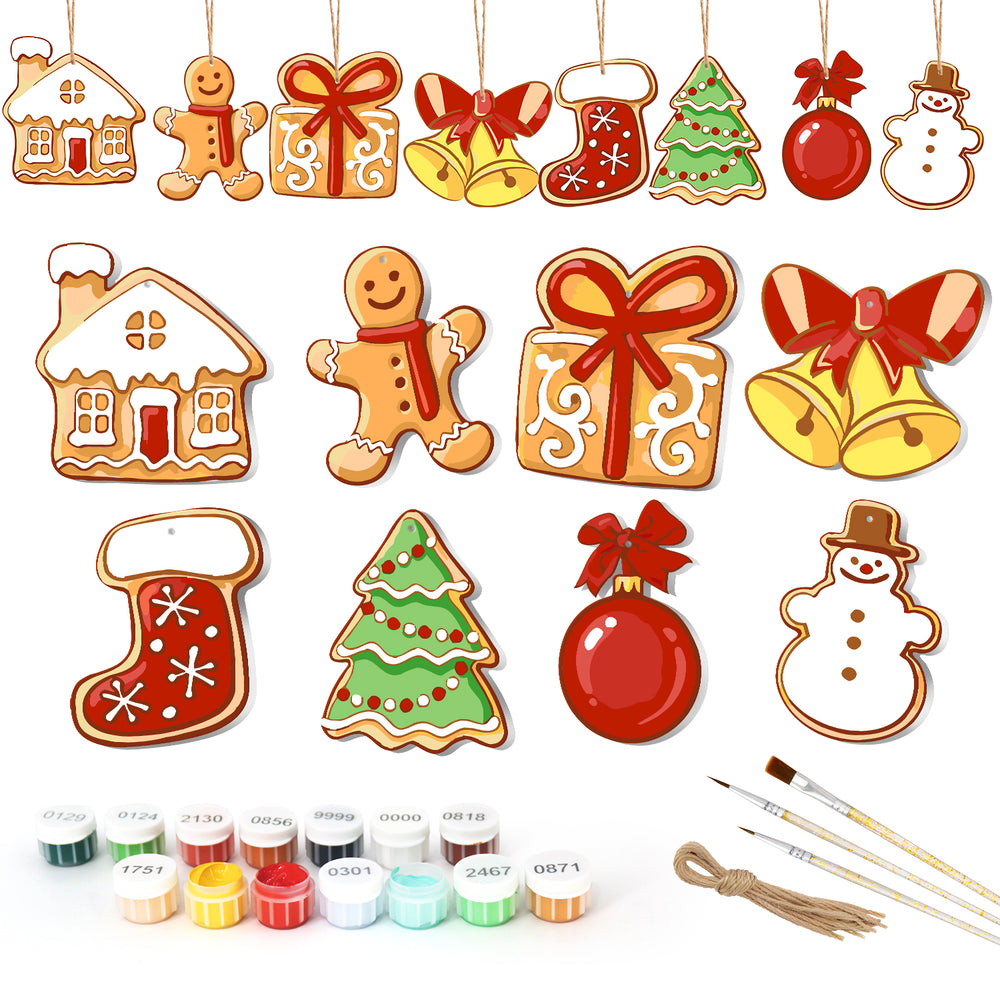 Set of Christmas-themed ceramic decorations with painting supplies on a white background