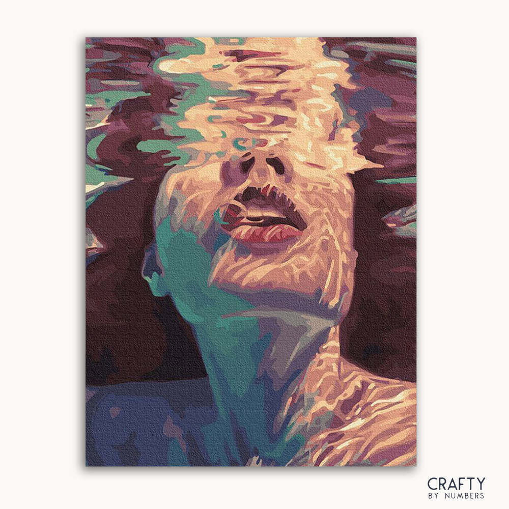 A paint-by-numbers kit depicting a abstract image of a woman's face partially submerged in water with vivid colors and brush strokes.