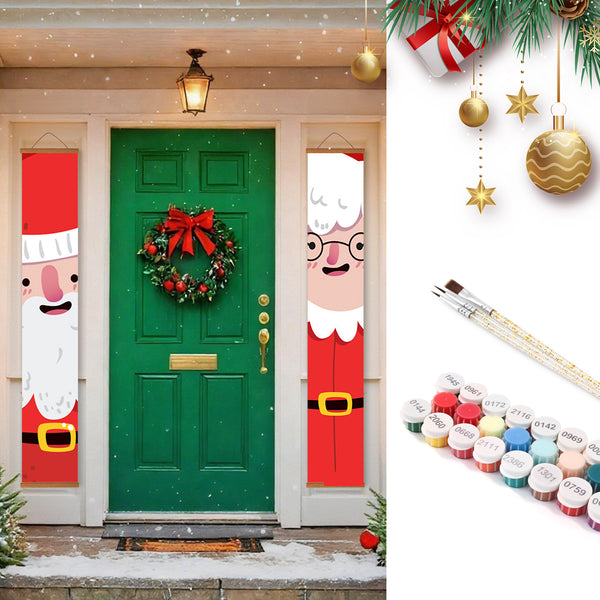 Decorative Christmas door with Santa Claus banners and a wreath, next to paint cans and brushes.