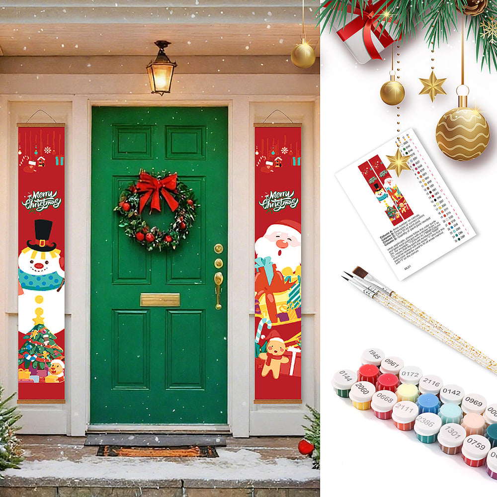 Decorative Christmas banners on a door with festive items and paint supplies.