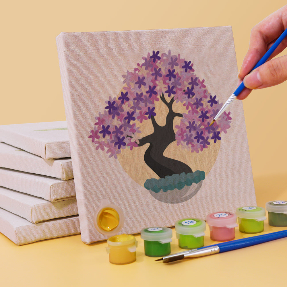 Close-up of Eternal Bonsai mini paint by numbers canvas and brushes