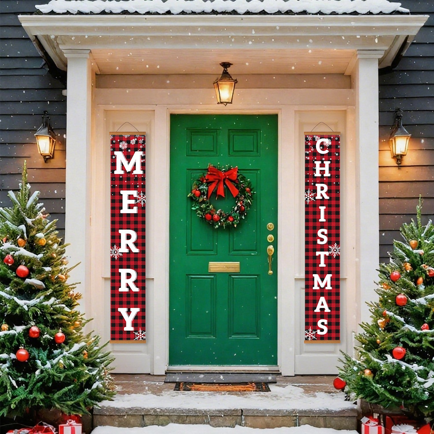 Green door with Christmas wreath flanked by red and black 'Merry Christmas' banners, surrounded by snow-covered trees.