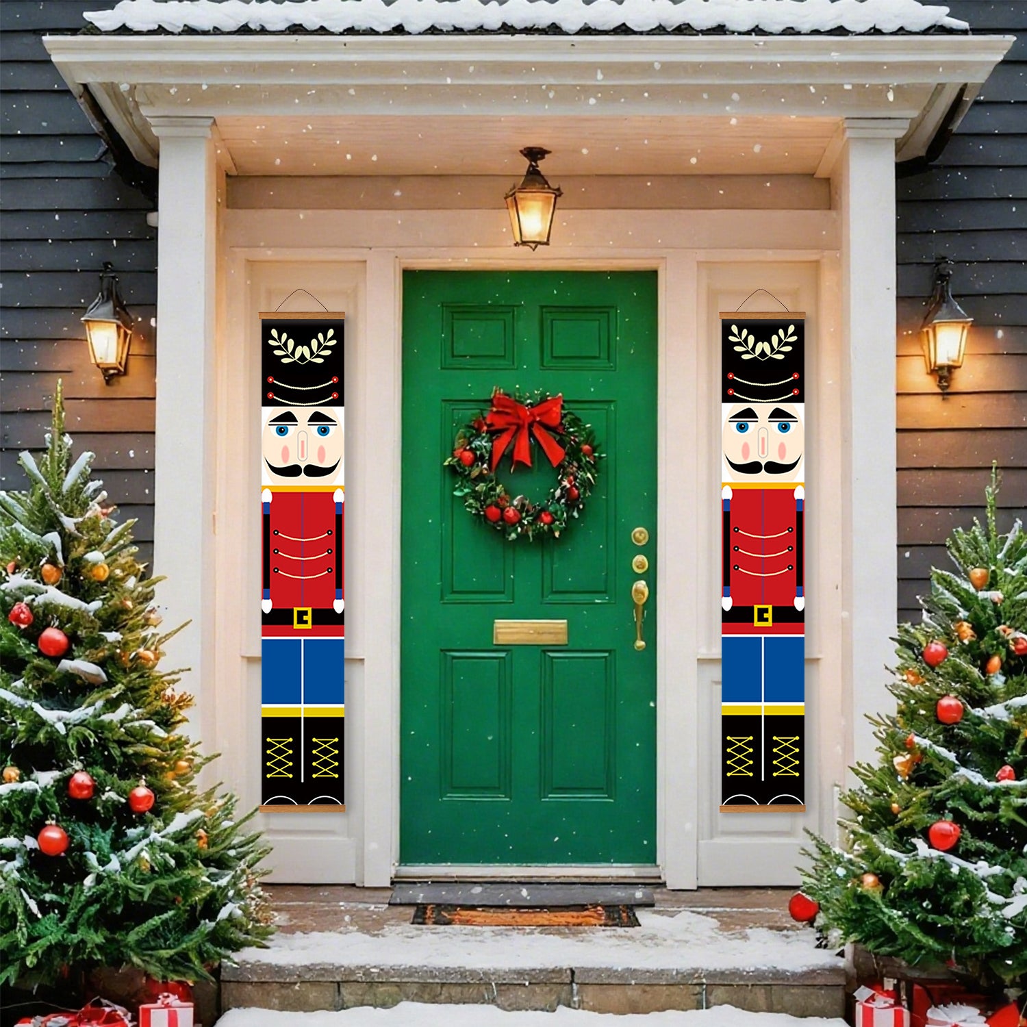Green door with Christmas wreath flanked by nutcracker decorations, surrounded by snow-covered trees.