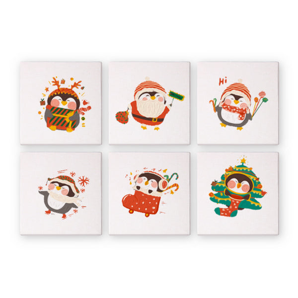 A set of six paint-by-numbers canvases with cartoon penguins dressed in holiday attire.