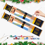 Decorative rolling paintboards with a hand holding a brush, surrounded by paint cans and Christmas decorations.