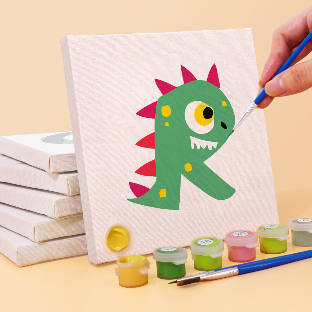 Hand painting a cartoon dinosaur on a canvas with art supplies on a yellow background
