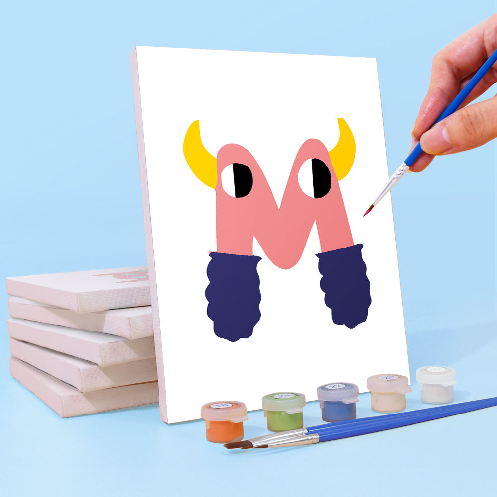 Hand painting a colorful letter 'M' on a white board with paint supplies.