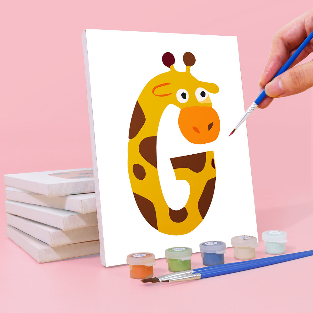 Hand painting a number '5' shaped like a giraffe on a white canvas with paint supplies on a pink background.