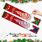 Christmas-themed painting set with Santa Claus design, paint cans, and a hand holding a brush.