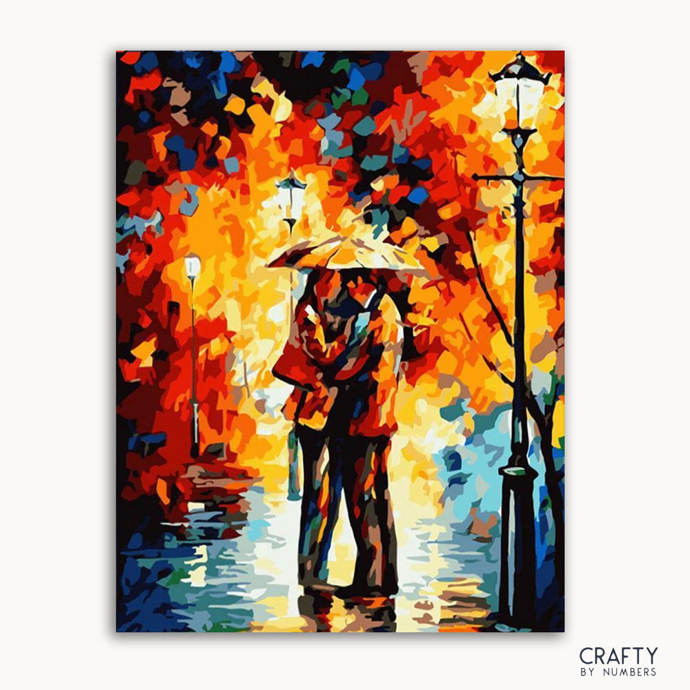 A paint by numbers kit depicting a scene with two lovers under an umbrella, surrounded by colorful autumn-like foliage and street lights.