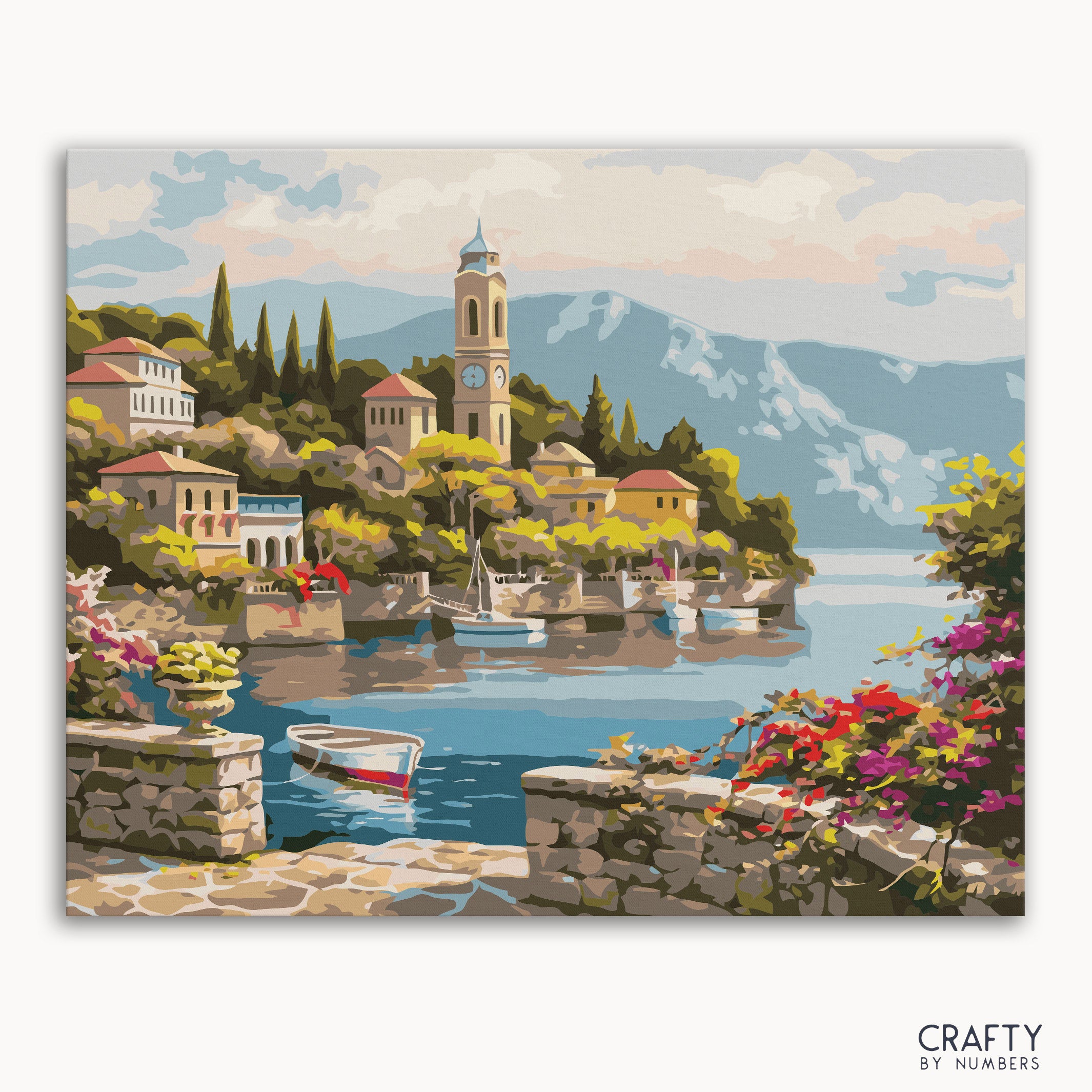 A painting kit representation of a serene village by a lake with mountains in the background, houses, a boat, and a clock tower, titled 'Lake Como Village'.