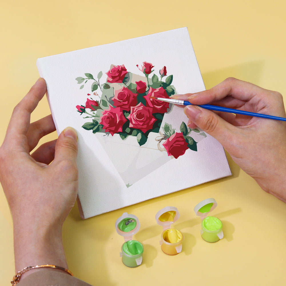 Set of paints and brushes included in Timeless Roses mini paint kit