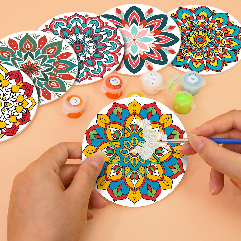 Mandala Magic Coasters with intricate mandala patterns reflecting famous landscape paintings elements.