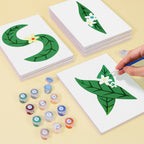 Children's craft activity with leaf and flower designs on cards and paint containers.