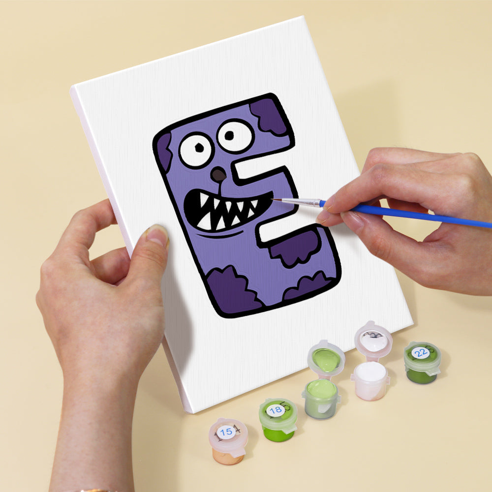 Person painting a cartoonish purple character on a white sheet with paint containers below.