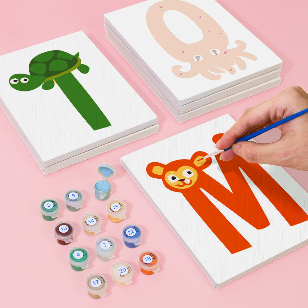 Children's educational activity set with letter cards and paint pots on a pink background