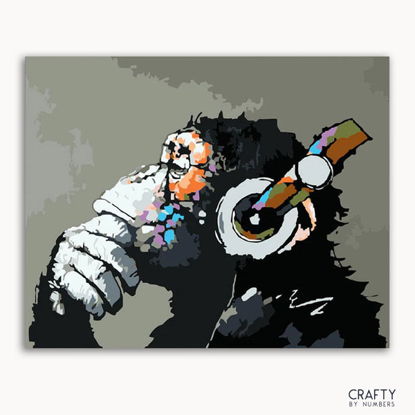 A paint-by-numbers kit depicting a monkey with a headset in a stylized, surreal art style.