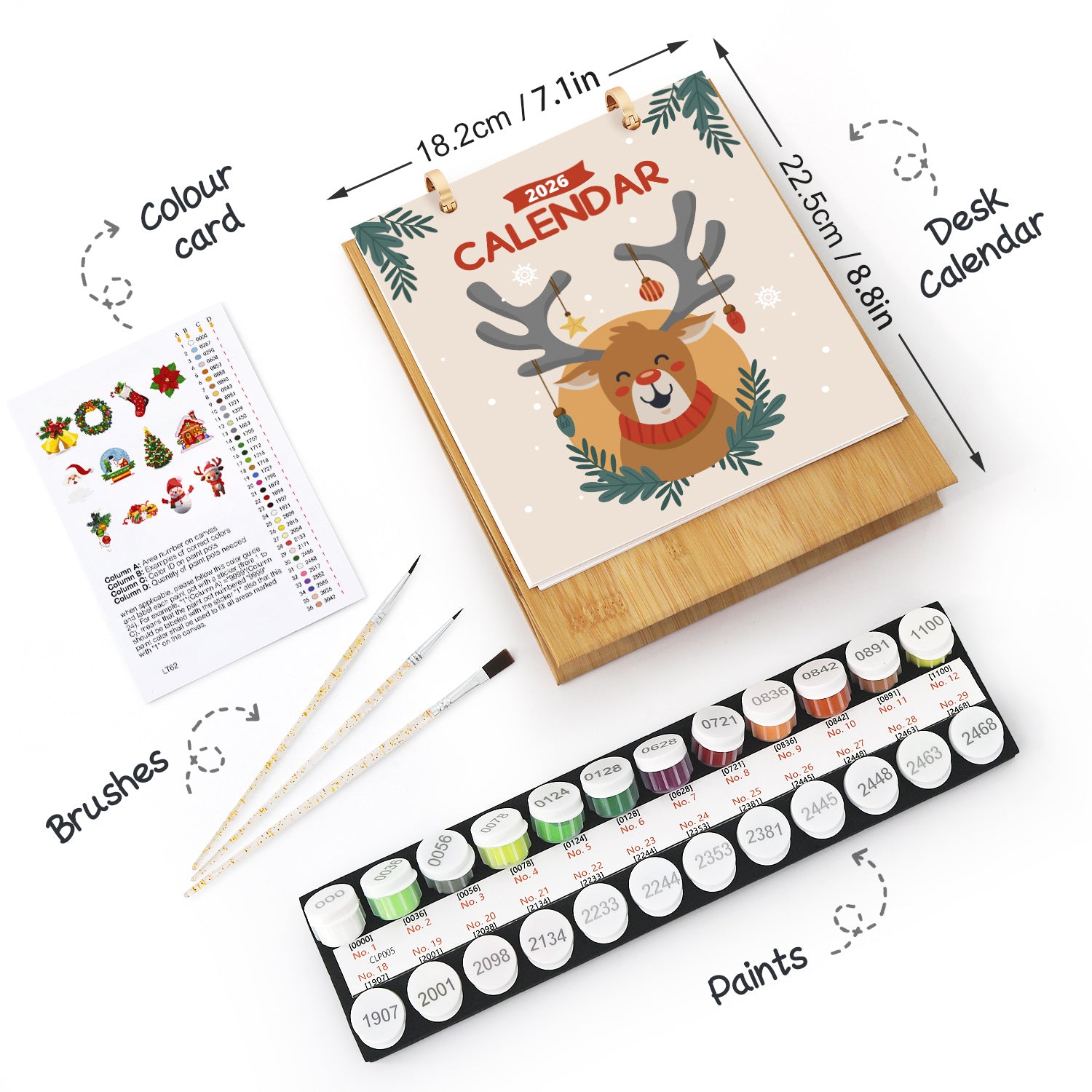 Artistic set with calendar, paintbrushes, and paint tubes on a white background