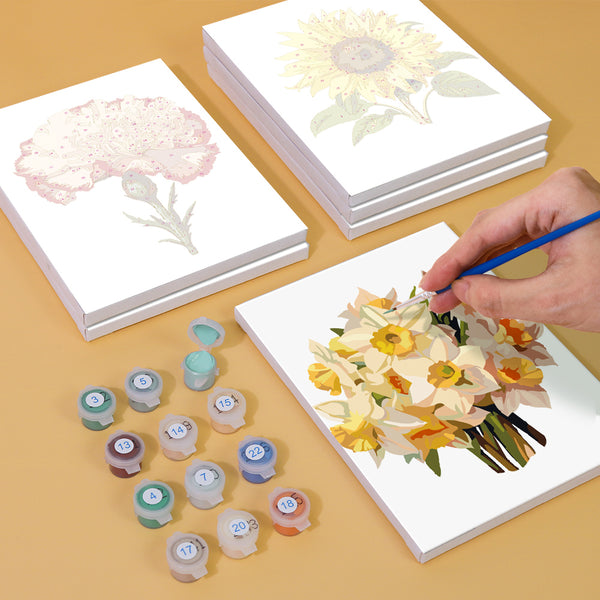 Vibrant pink and yellow flowers in a harmonious bouquet on canvas