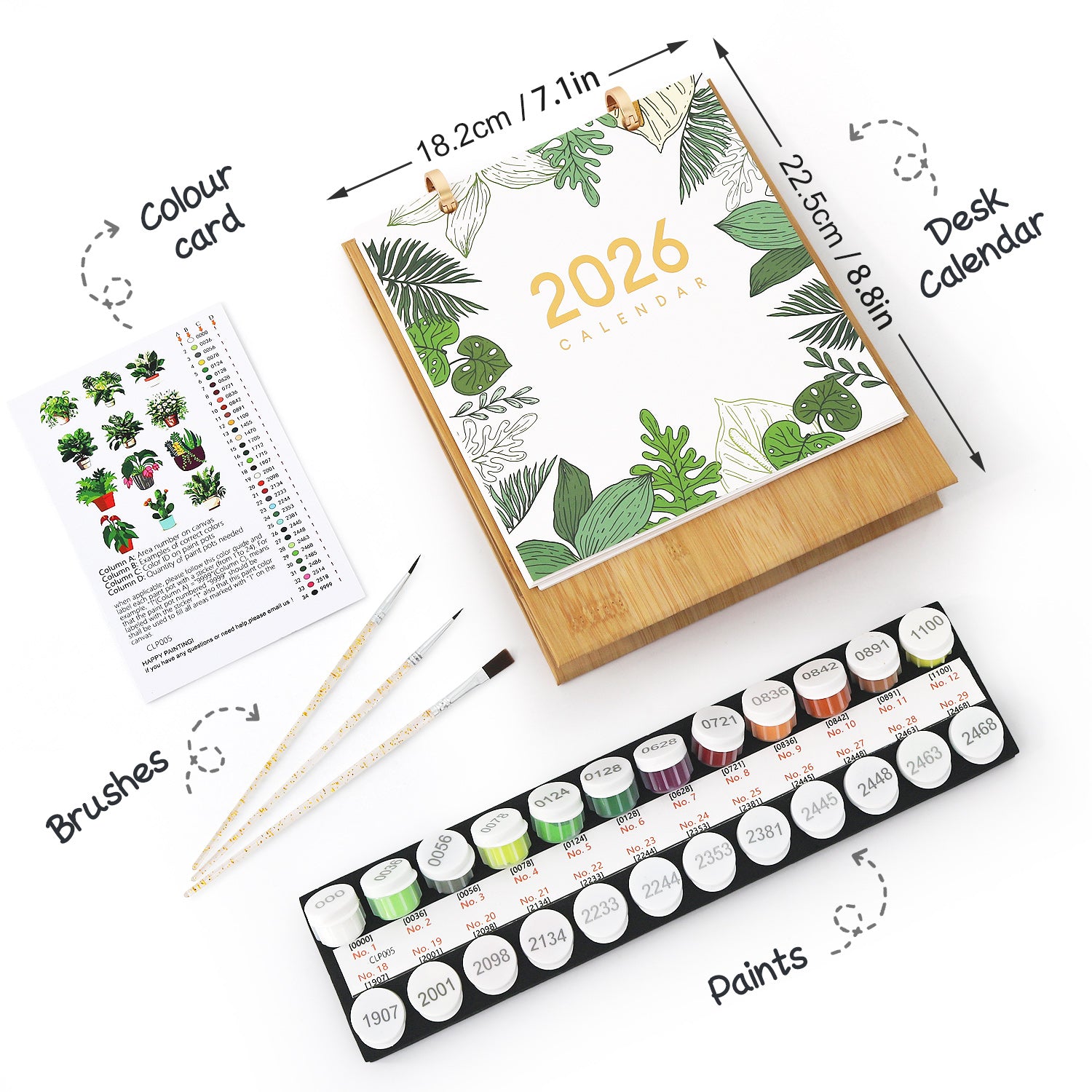 Calendario 2026 con juego de pintura, pinceles y tarjeta de color sobre un fondo blanco.