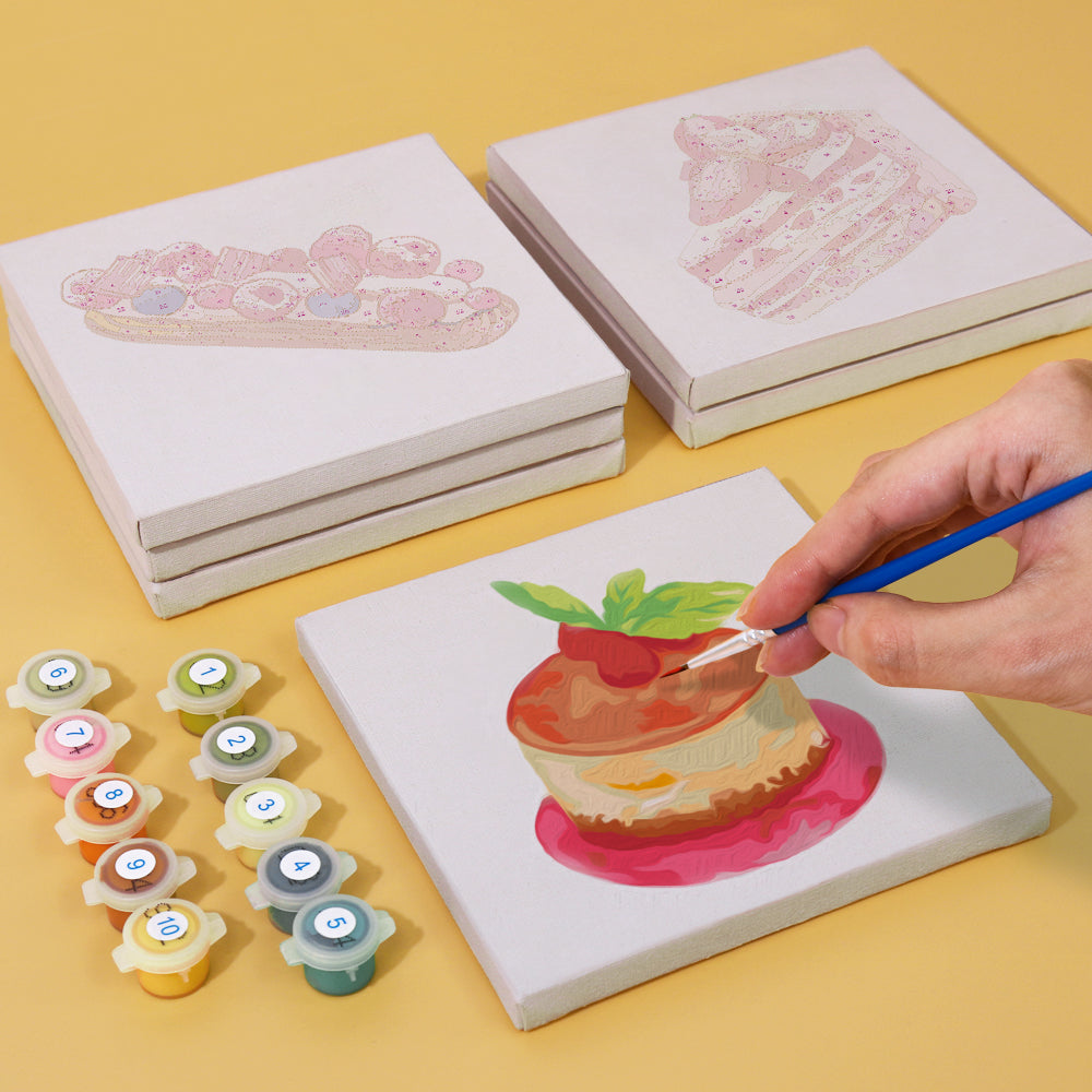 Assorted Baked with Love mini paint by numbers kits on a table