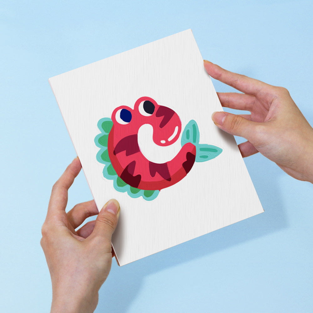 Card with a colorful caterpillar design held by two hands against a light blue background