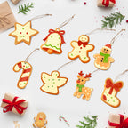 Decorative Christmas cookies shaped like various holiday items on a white background with gift boxes and trees.