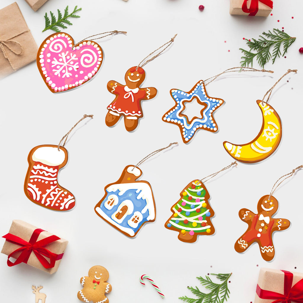 Colorful Christmas-themed cookie cutout ornaments on a white background with gift boxes and candy canes.